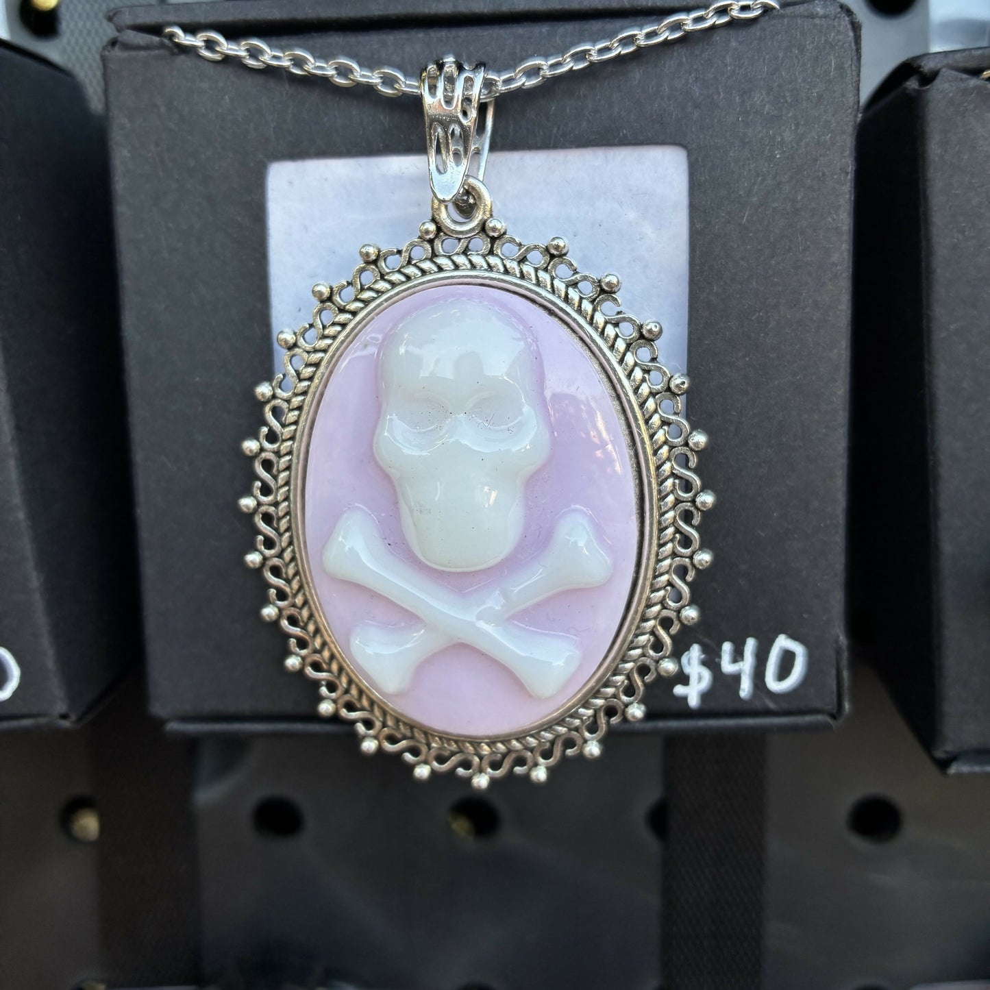White on pink skull cross bones cameo