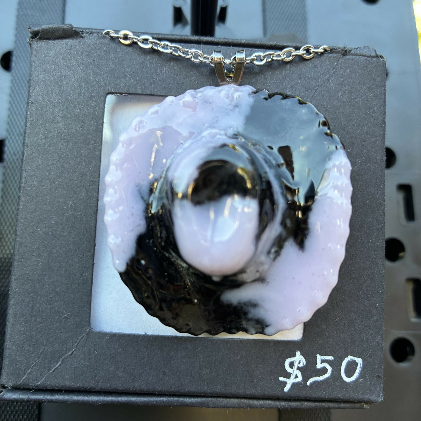 Pink and black cowboy hat