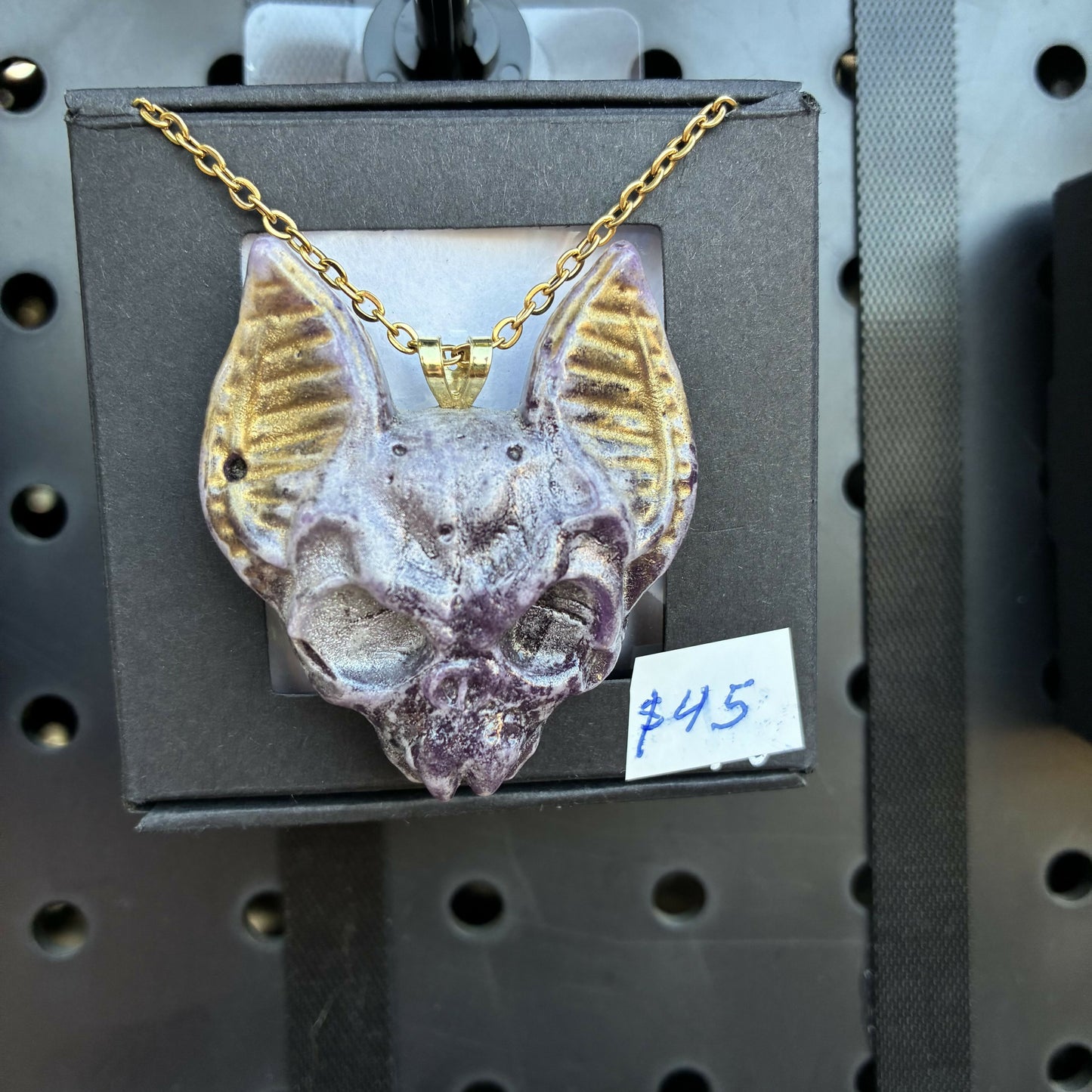 Lavender and gold bat head