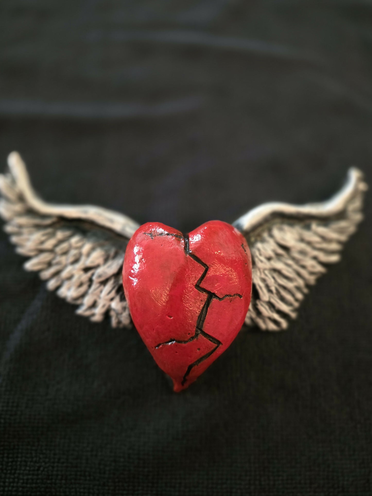 Broken heart with wings
