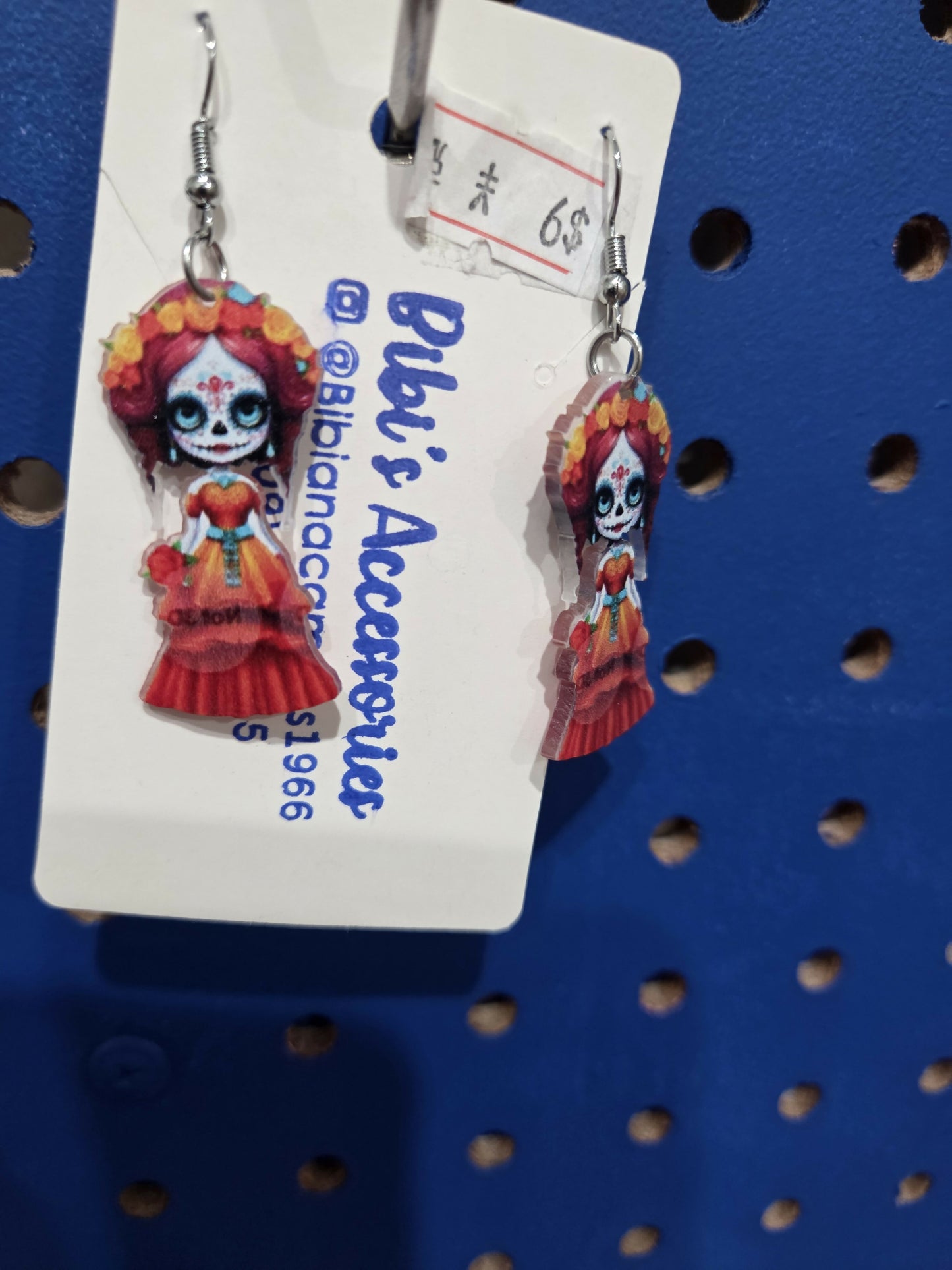 Aretes catrina resina