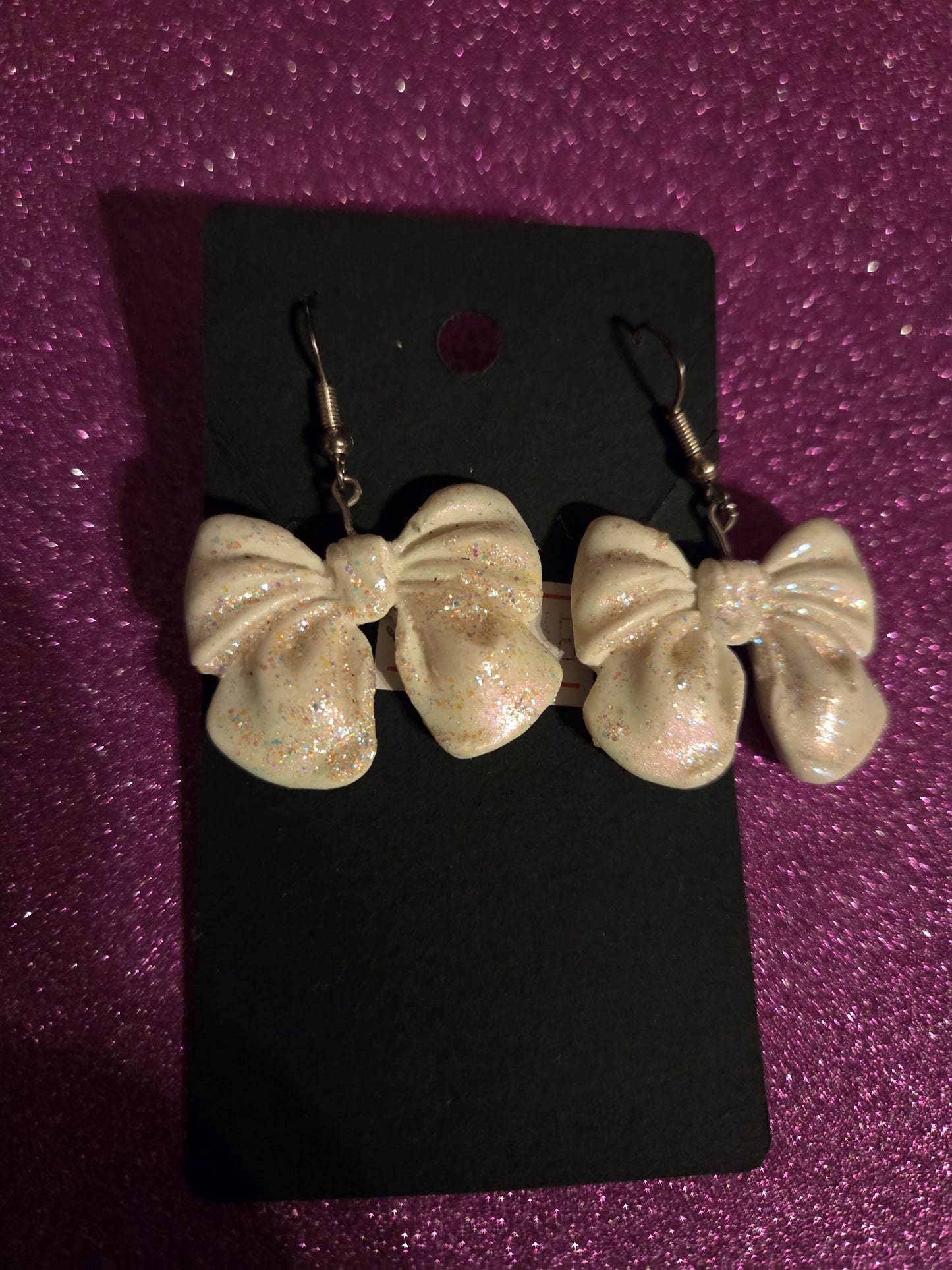 Aretes blancos glitter bow